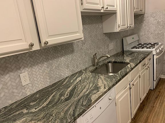 Kitchen highlighting counters and backsplash (appliances were replaced after this picture)