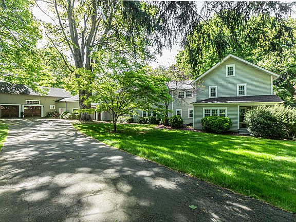 This striking antique home has been enlarged and updated reflecting today's transitional style with warmth and ambiance.