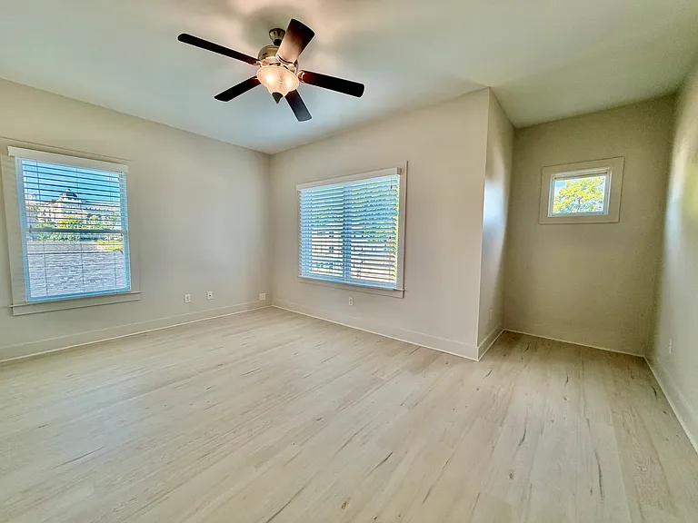 Second bedroom with ceiling fan and views of Belmont college