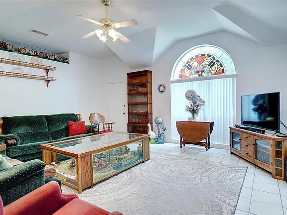 VIEW OF LIVING ROOM FROM DINING AREA.