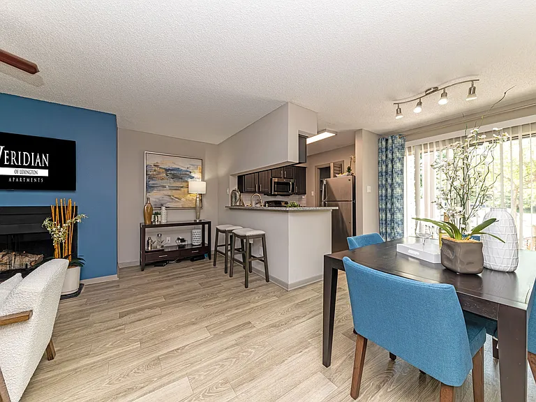 Dining area & breakfast bar with hardwood-style flooring throughout