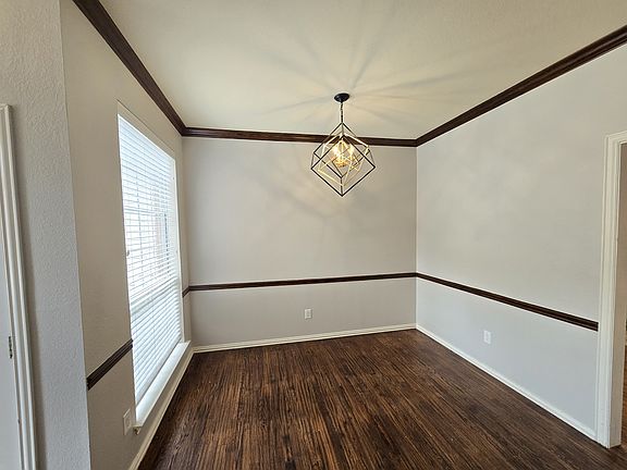 formal dining w/ updated light fixture