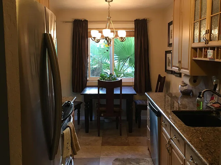 Beautifully upgraded galley kitchen - granite tops, all stainless steel appliances.