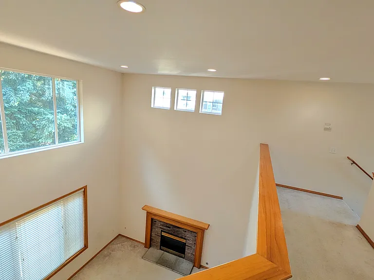 Living room with soaring two story high ceiling
