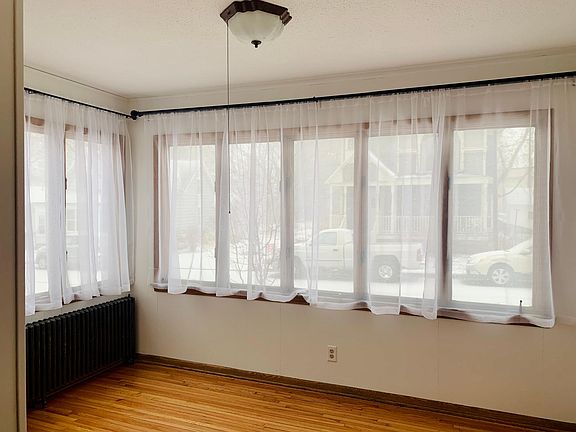 Front room fully insulated, can be used as 2nd bedroom, office, den, sunroom, etc.