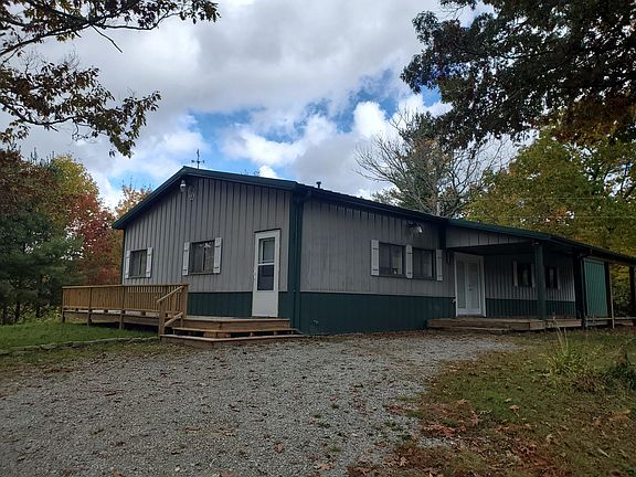 Parking area and entrance to house