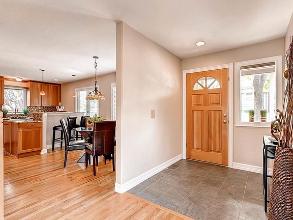 Entry and view of kitchen and eating nook.
