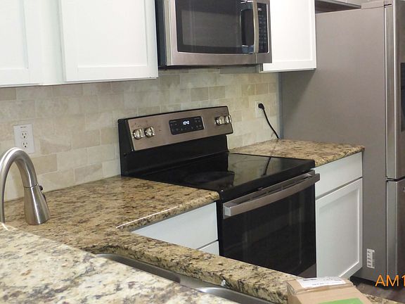 Built-in microwave; kitchen also has pantry closet