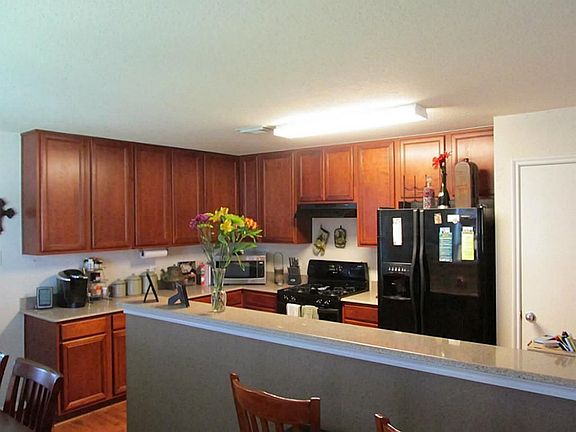 VIEW OF KITCHEN AND BREAKFAST BAR