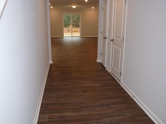Large open foyer with window for light and coat closet.
