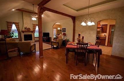 Dining Room/Living Room
						:
						View from the Front Door. Hardwood floor throughout.