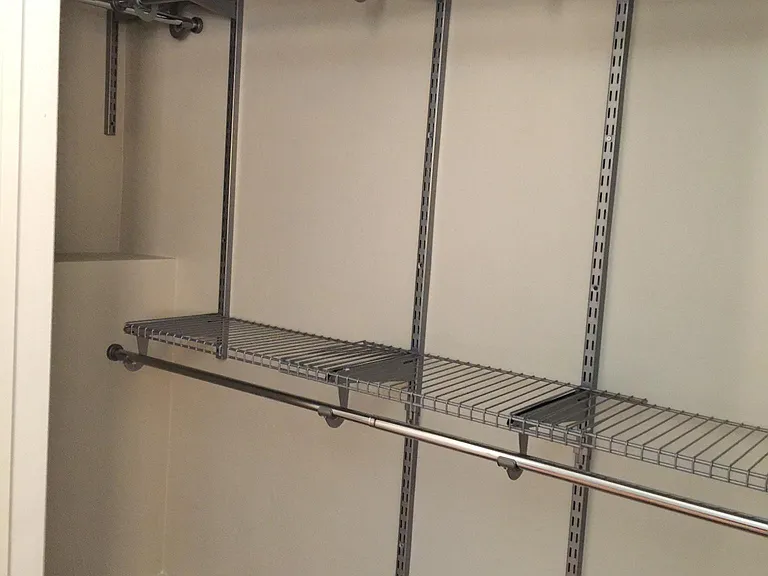 Bedroom 2 closet with adjustable shelves