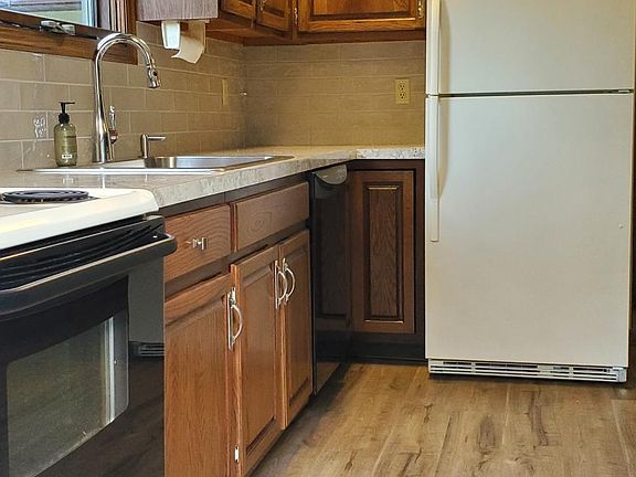 Updated kitchen, all new floors, sink, faucet, range hood and refinished cabinets