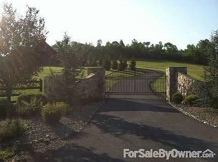 Gated entrance...
						:
						Gate operated by car controllers, panel, and from home.