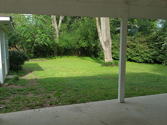 Carport overlooking backyard