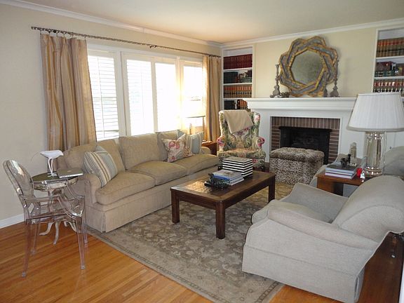 Large Living room with gas fireplace. Lots of natural light!