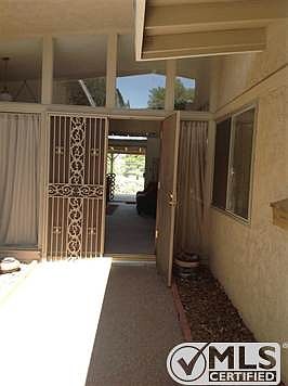 Security doors open up to the view of the golf course. Hey Golfers!