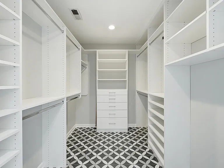 Custom walk-in closet with built-in organization