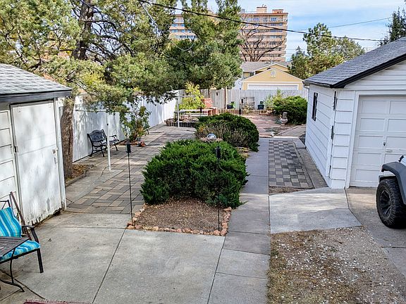 Spacious back yard features privacy fence on three sides