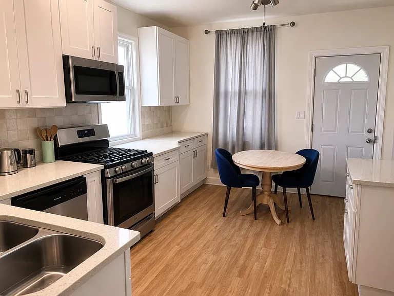 Large updated kitchen with lots of cabinet storage.