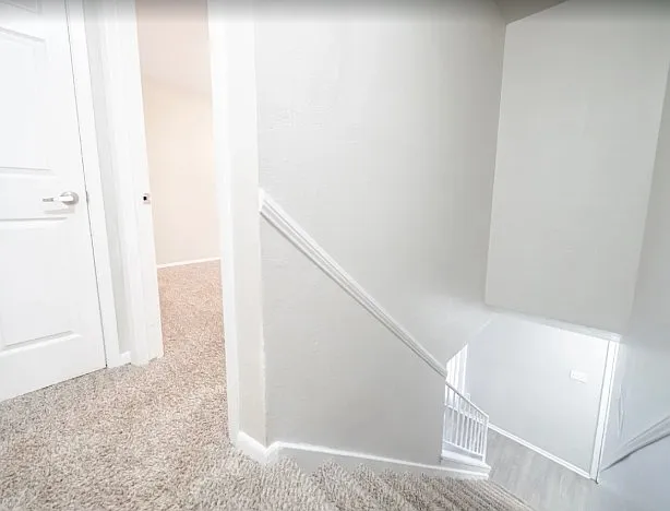 Upper stairway landing in townhome