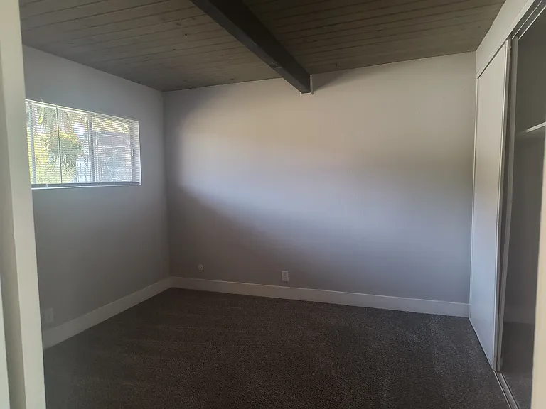 Spacious bedroom with floor to ceiling closet.