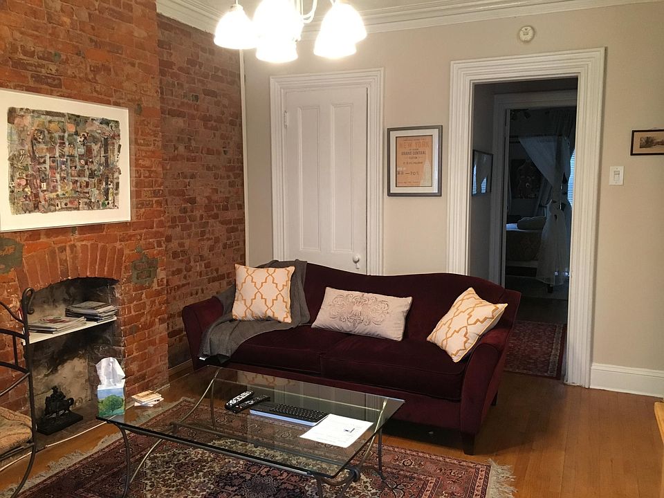 Exposed brick living room, tastefully decorated.