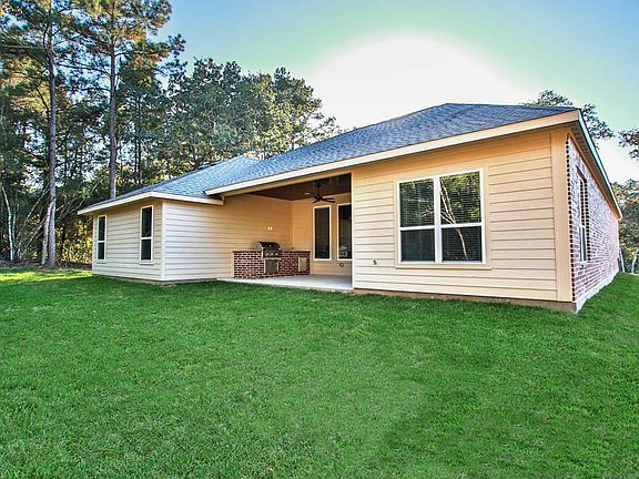 Features a covered outdoor kitchen