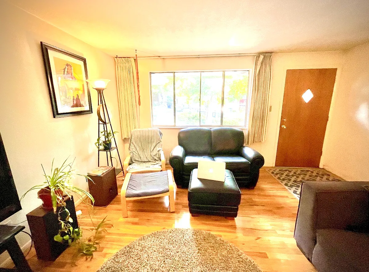 Spacious living room with east facing window (unit is for rent unfurnished). - Zephyr St