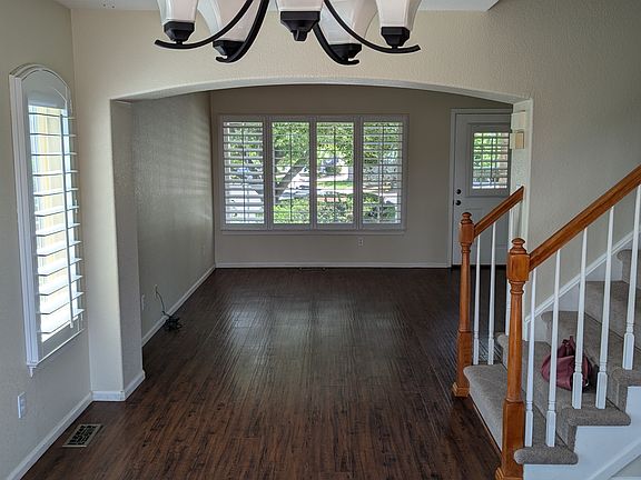 Dining room foreground; LR background - looking towards front yard - stairs to upstairs