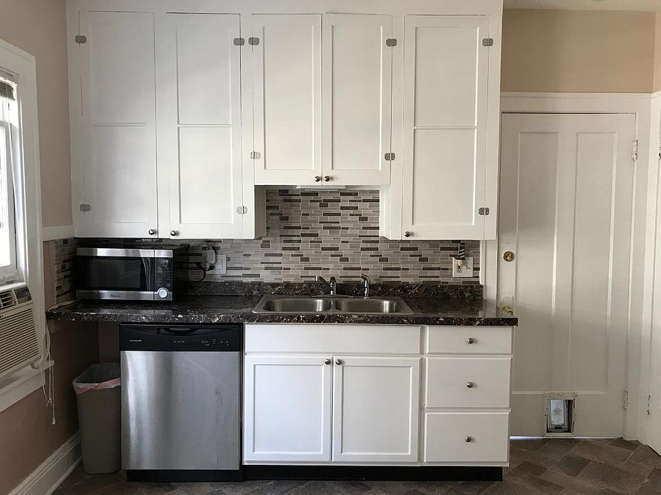 Remodeled kitchen with stainless steel appliances.