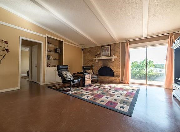 Spacious family room with cozy fireplace
