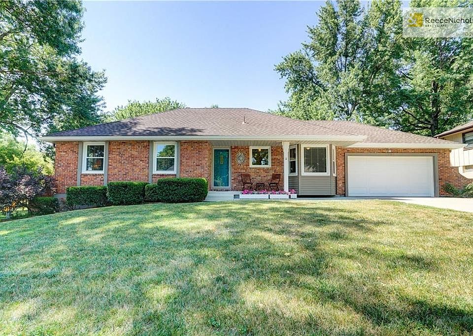 A covered front porch compliments the superb curb appeal of this ranch home.
