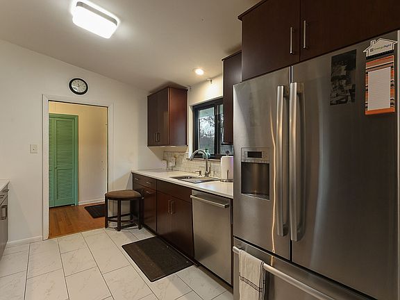 Galley kitchen with quartz countertops