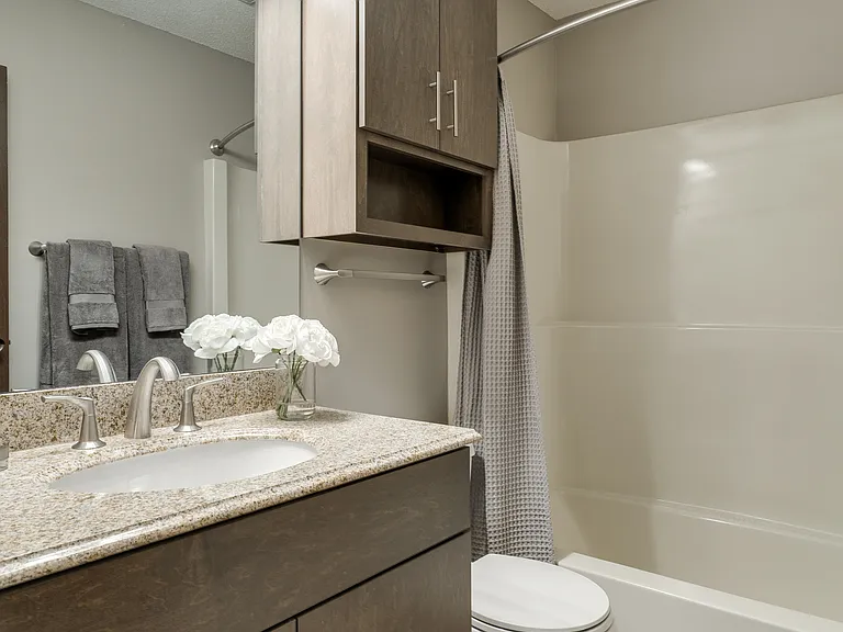 Stone countertops and ample cabinet space