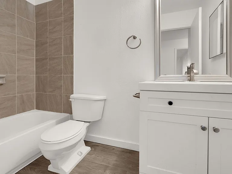Newly Renovated Bathroom with Tile Surround