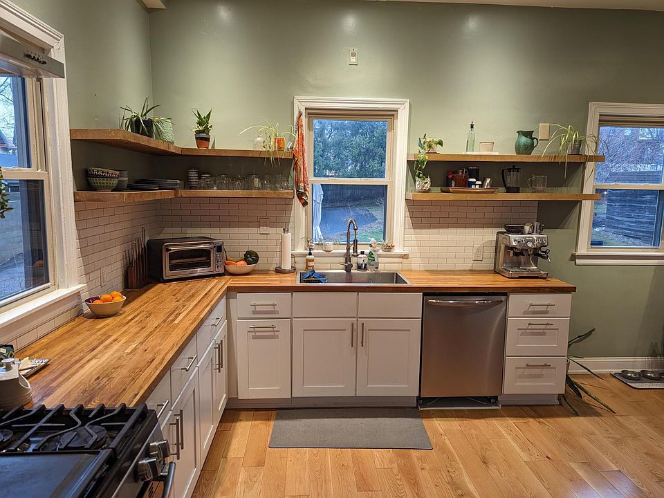 Newly renovated kitchen. Hardwood floor, custom shelves, new appliances, butcherblock countertop.