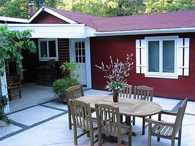 View of home from landscaped patio