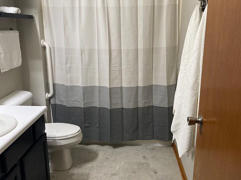 Master bathroom has a tub/shower and is separate from the walk in closet.