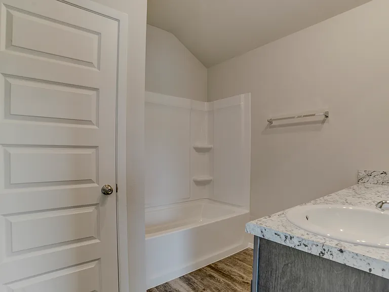 Another point of view of the master bathroom. Linen closet to the left. Walk-in closet further to the left.