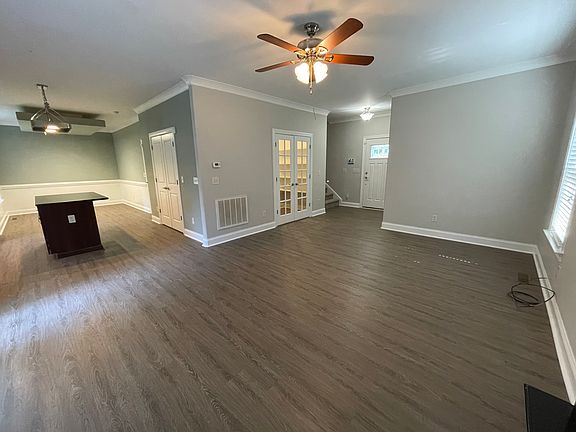 View of the Living Room, Office w/ French Doors, and the Kitchen w/ an island