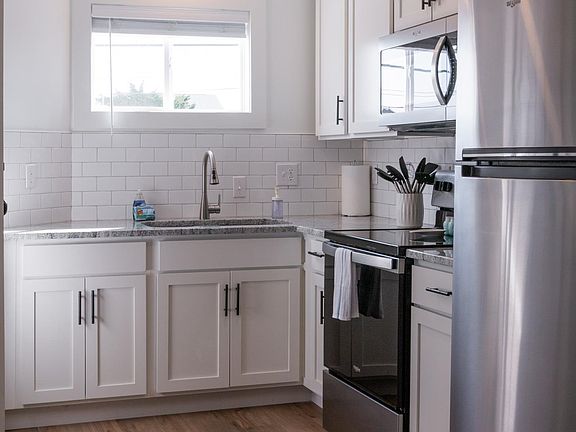 Renovated kitchen with new stainless steel appliances