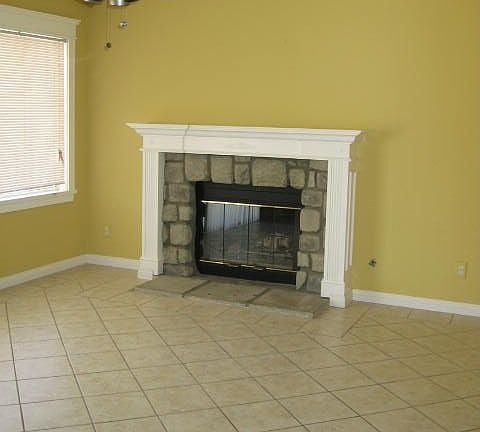 The family room features a fireplace and nice tile flooring