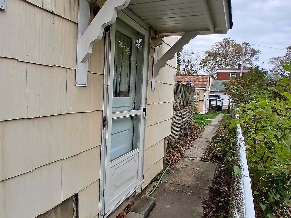 Tenant entrance with motion-sensitive security light by door.