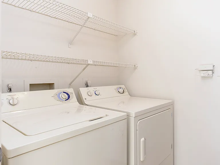 Laundry room with storage space