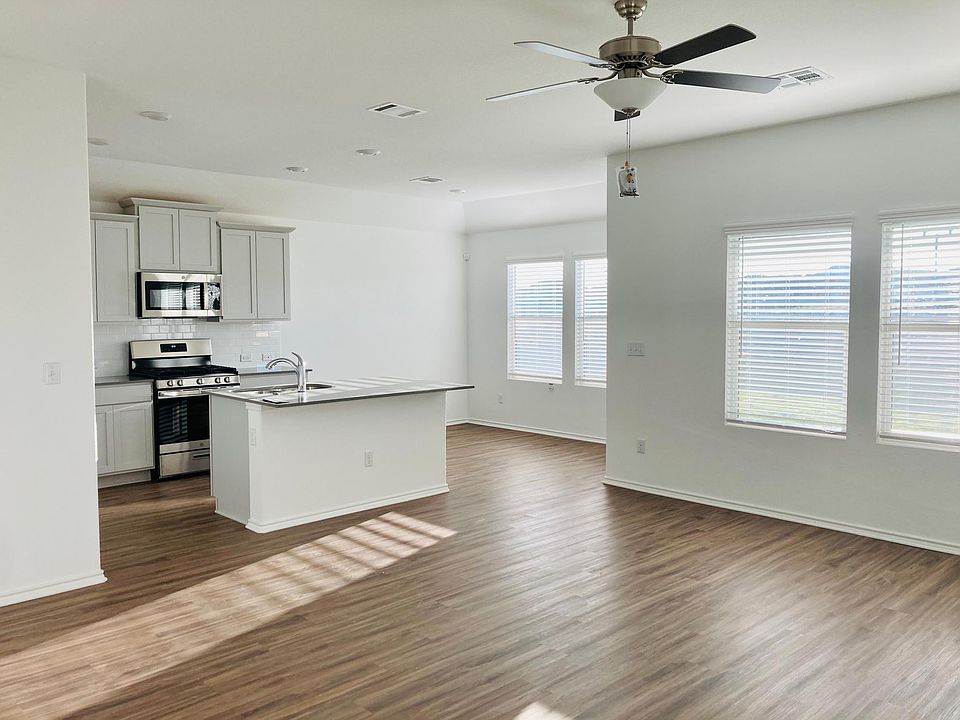 Natural light is so abundant! Great open living space, spacious kitchen/pantry with a designated area for dining table.