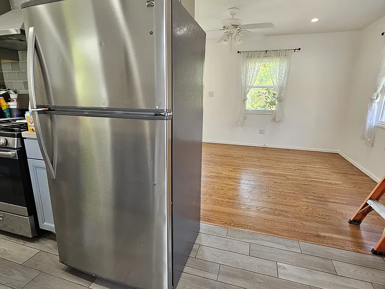 Kitchen on the left, looking towards front room.