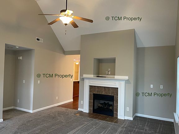 Great Room with lots of light and propane gas fireplace
