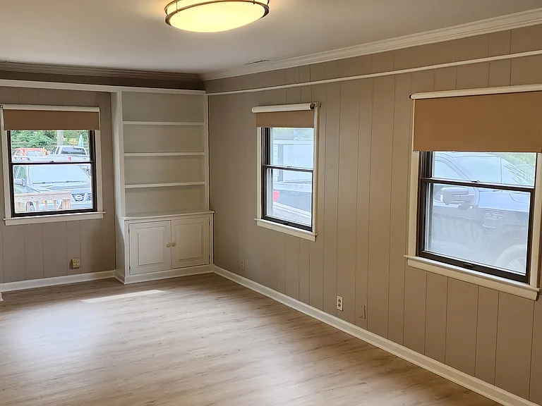 Light and bright large living room with custom built-ins
