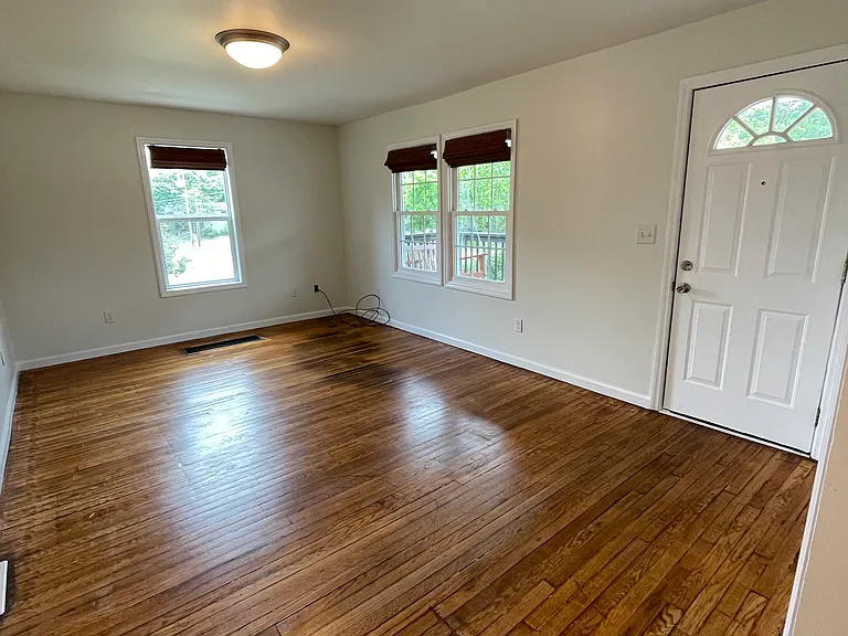 Living/family room with lots of natural light.